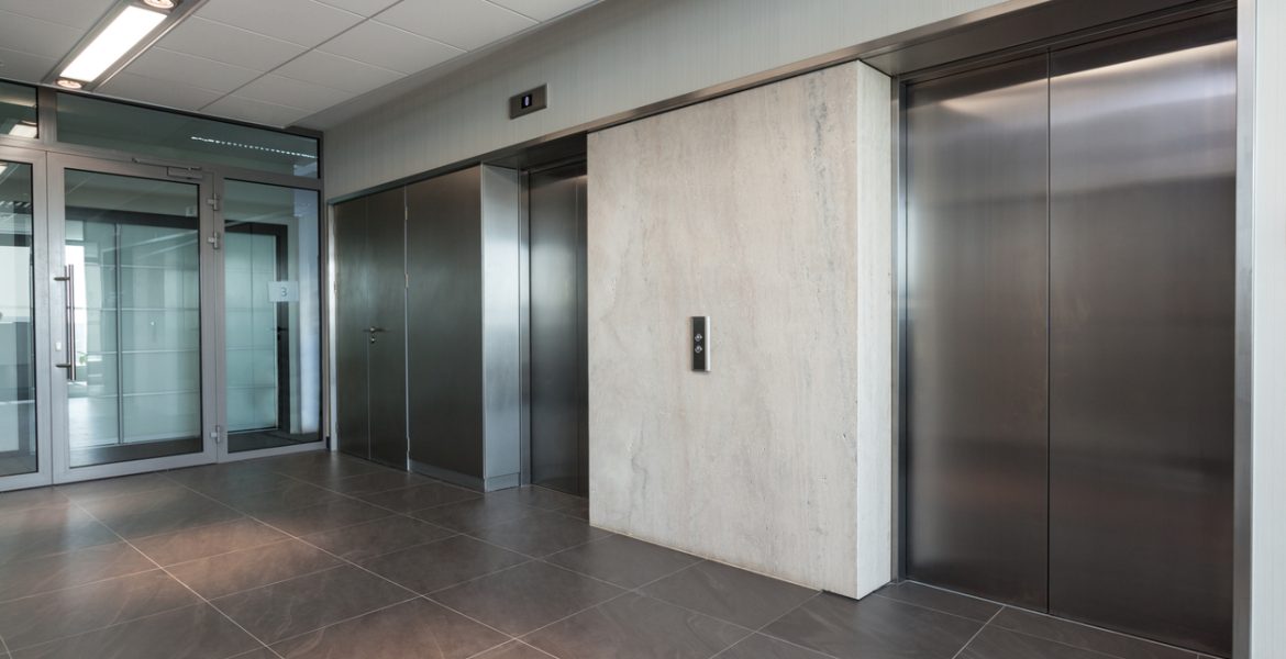 Elevators Shining silver elevator in a modern office building